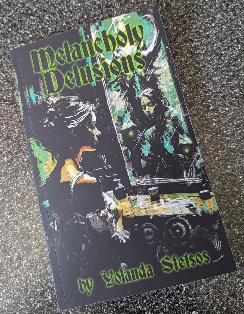 The paperback of Melancholy Delusions with the title on top and my name on the bottom, both in green. Beautiful cover featuring a woman looking into a mirror with some creepy things in the reflection.

Cover made by Luke Spooner/Carrion House.