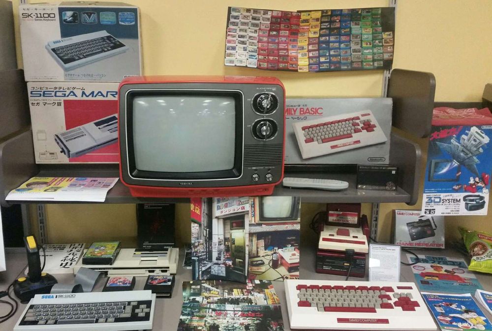 just a section of the japan exhibit at bloop, featuring a famicom, sega mark 3, and more