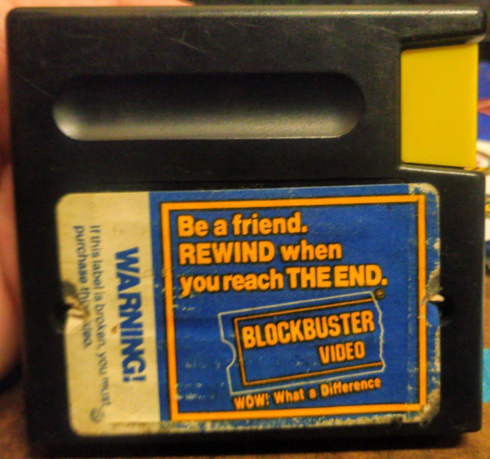 an electronic arts sega genesis cartridge with a "be a friend. rewind when you reach the end." blockbuster sticker on the back.