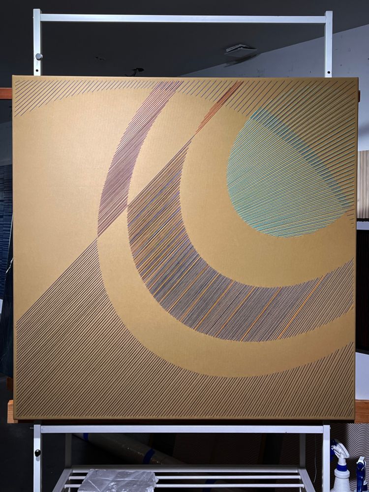 40” x 40” square abstract embroidery work, parallel straight lines describing a curved, almost Saturn-like design on a tan cotton background.