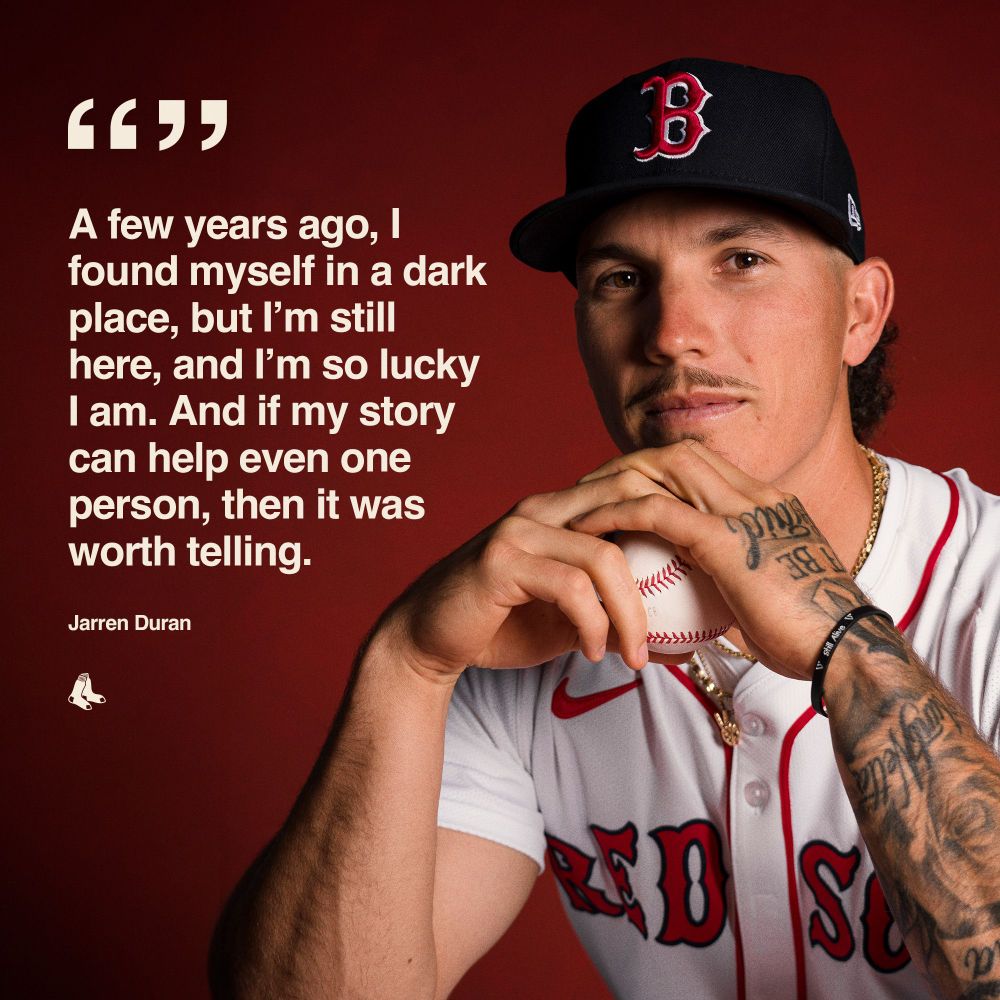 "'A few years ago, I found myself in a dark place, but I’m still here, and I’m so lucky I am. And if my story can help even one person, then it was worth telling.' - Jarren Duran" Image shows portrait of Jarren Duran sitting and holding a baseball in home white uniform. 