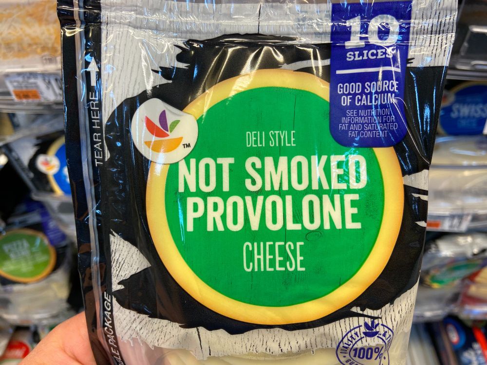 A bag of cheese labeled "NOT SMOKED PROVOLONE"