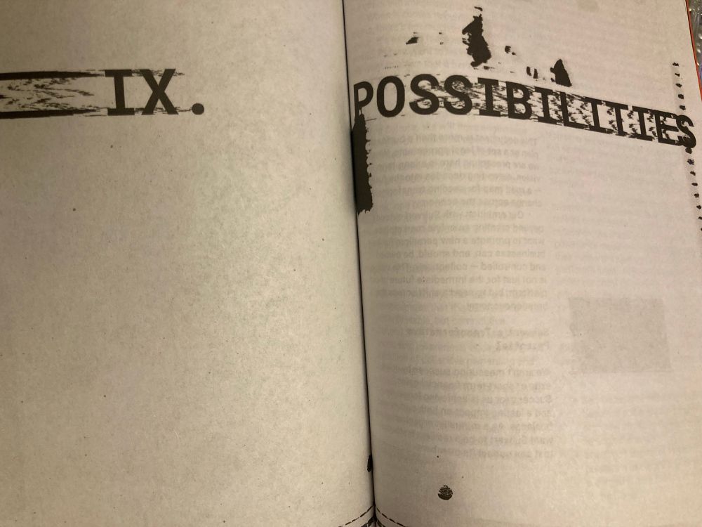 a photo of a page from the zine with ink marks and smudges that look like cool printing glitches. the page on the left says IX. and the page on the right says POSSIBILITIES. you can see some of the text from the next page through the paper. 