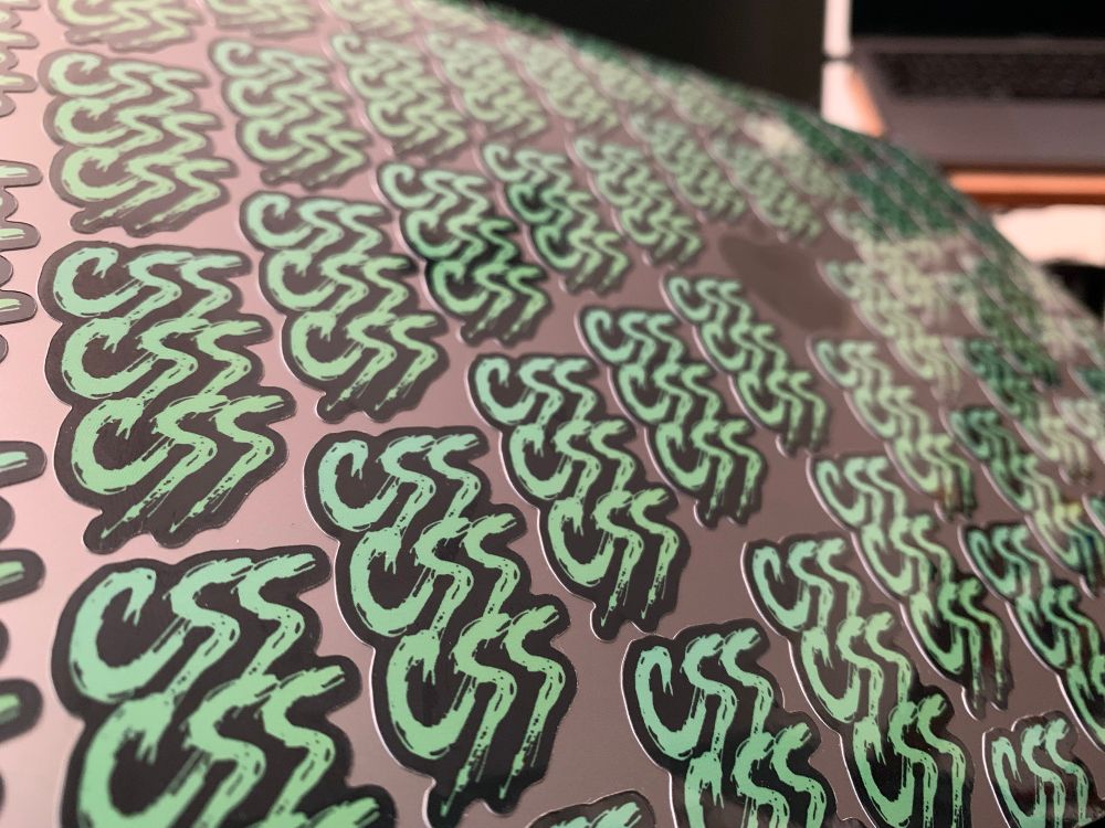 MacBook covered in 64 identical CSS stickers 
