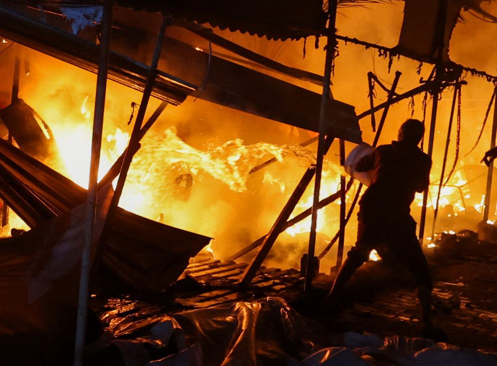 Live: Palestinians burn to death after Israeli strike on Gaza hospital sets tents on fire