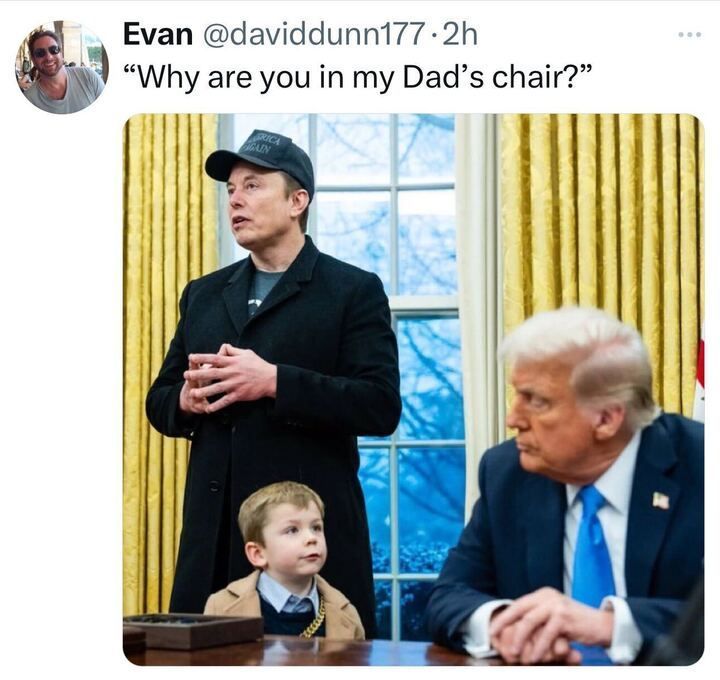 Twitter post from Evan 
@davidddunn177
. The post reads: 'Why are you in my Dad's chair?' Below this text is an image showing three people in a room with yellow curtains and a window with a blue sky outside. One person is standing, wearing a black coat and a cap that says 'Make America Great Again.' Trump is sitting at a desk, wearing a blue suit and tie. Elon's son, dressed in a light brown coat and a gold chain, is looking up at Trump.