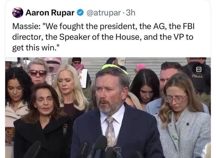 A tweet from “Aaron Rupar @atrupar” reads:
“Massie: ‘We fought the president, the AG, the FBI director, the Speaker of the House, and the VP to get this win.’”
Below is an image of a man speaking at a podium outdoors, surrounded by several people, with microphones in front of him.