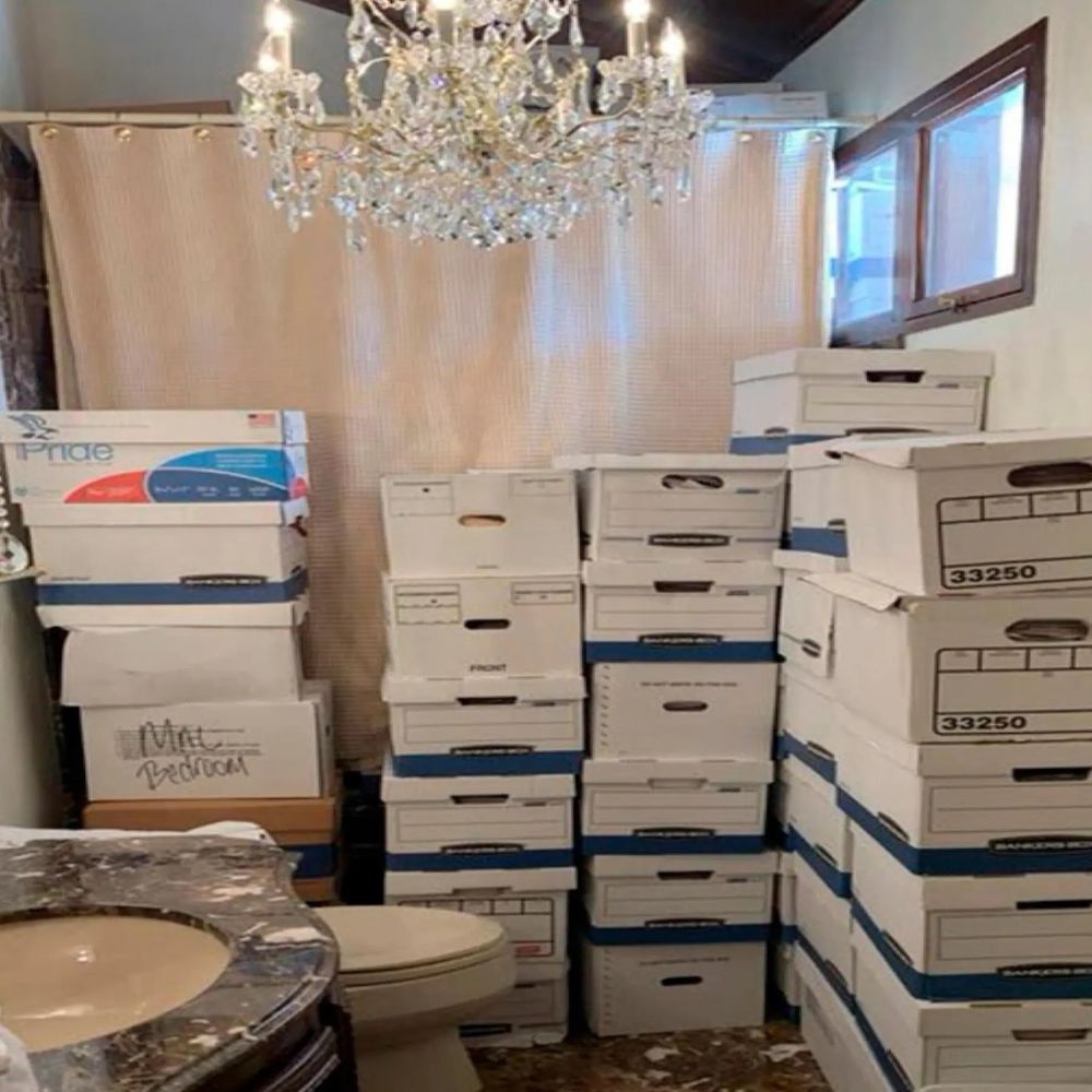 Shot of Mar-a-lago bathroom with classified docs stacked in boxes 