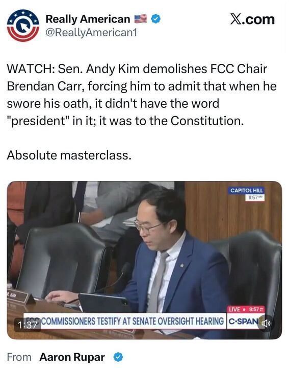 Tweet from Really American stating that Senator Andy Kim questioned FCC Chair Brendan Carr, prompting Carr to admit his oath was to the Constitution, not the president. Below is a C-SPAN video still showing Kim speaking at a Senate oversight hearing.