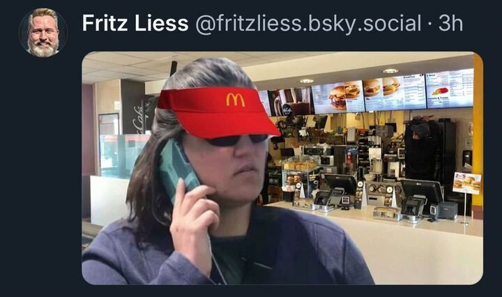 Tweet by Fritz Liess featuring an edited image of a woman wearing a McDonald's visor, sunglasses, and holding a phone to her ear. The background shows the interior of a McDonald's restaurant with the counter, menu boards, and equipment visible.