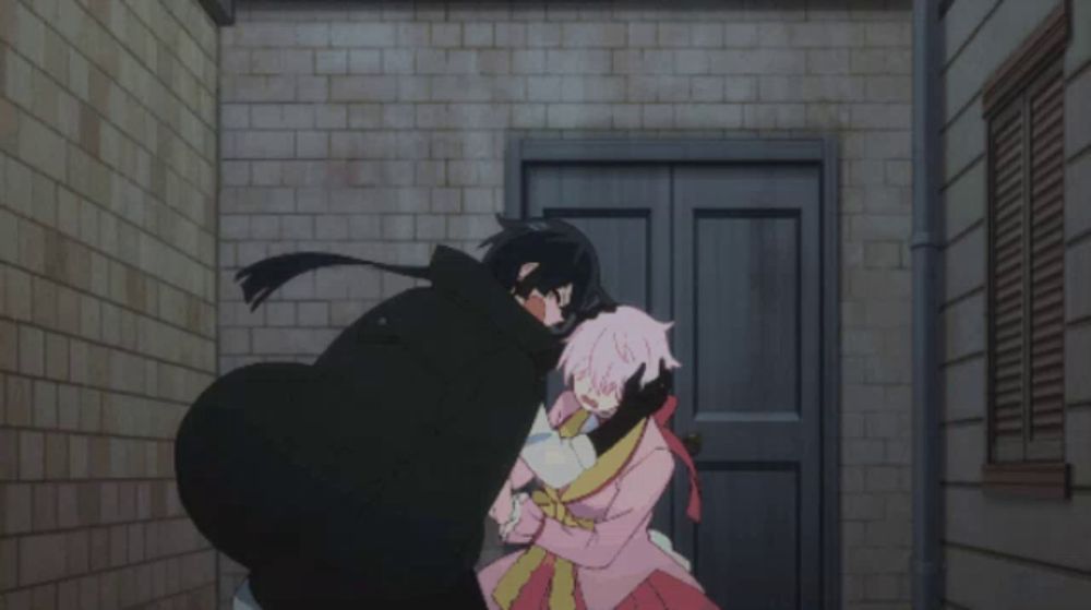 a man in a black cape is hugging a girl in a pink dress