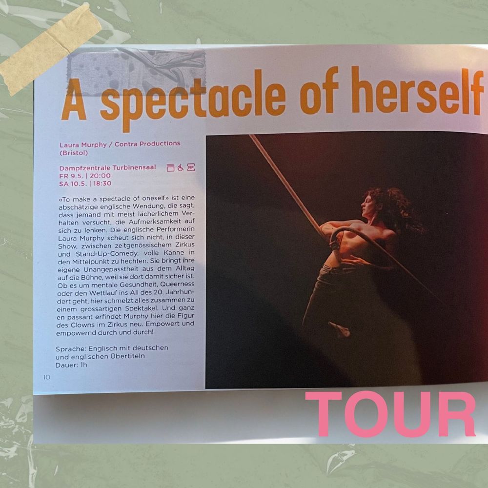 - A picture of the show listing in the festival brochure. In the image Laura - doing her best shirtless Diet Coke hunk impression - hangs of an aerial rope . Original image by @hollyrevellphotography 