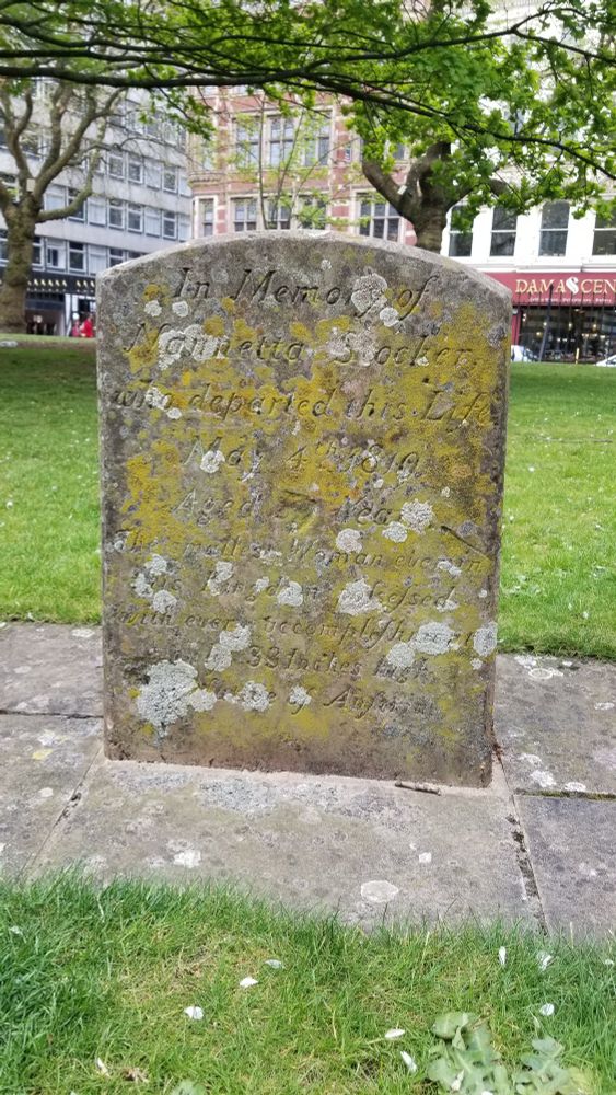 A small gravestone in the churchyard of St Philip's Cathedral In Birmingham, UK. The inscription is mostly obscured by lichen but with some effort it can be read:

In Memory of
Nanetta Stocker 
Who departed this Life
May 4th, 1819
Aged 39 Years.
The smallest Woman ever in
This Kingdom possessed
With every accomplishment 
Only 33 inches high.
Native of Austria.


