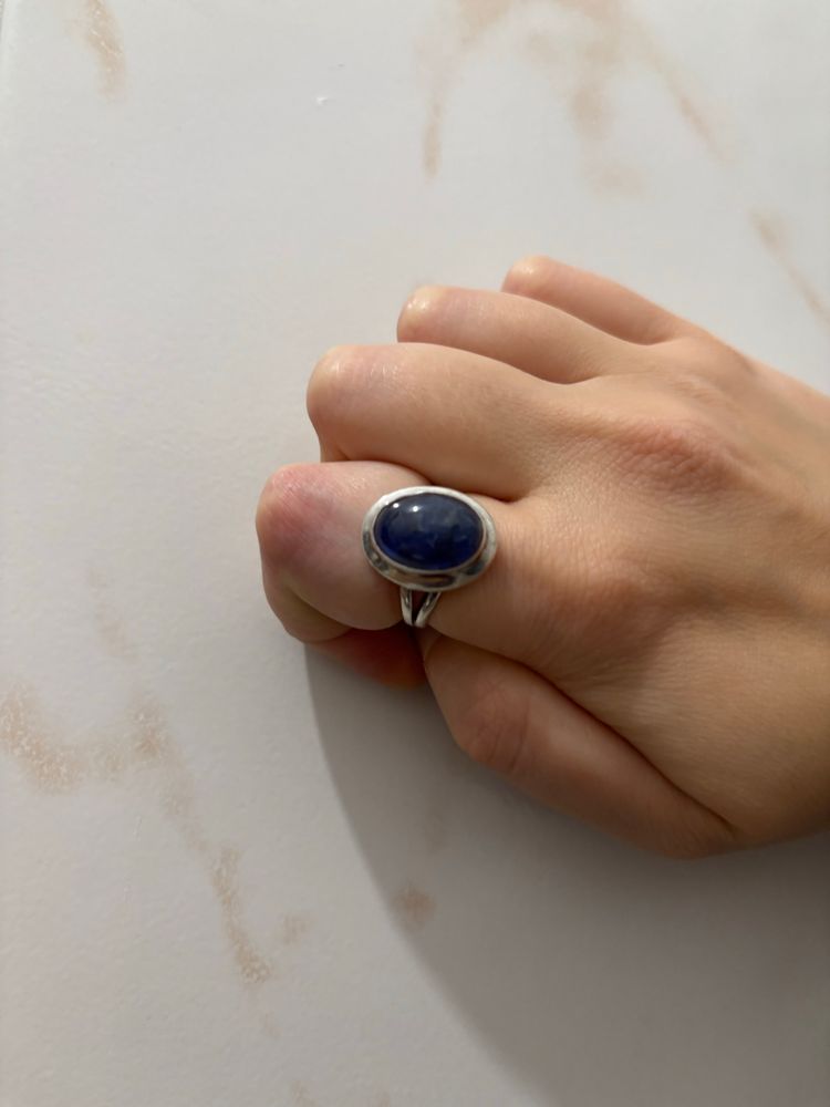 A silver ring with a kyanite stone on a right finger index. Photo taken on 2nd October 2025 by Nina Davtian (it’s me!).