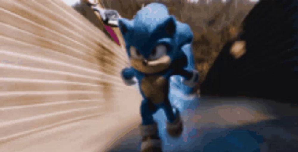 sonic the hedgehog is running through a tunnel with a blurred background