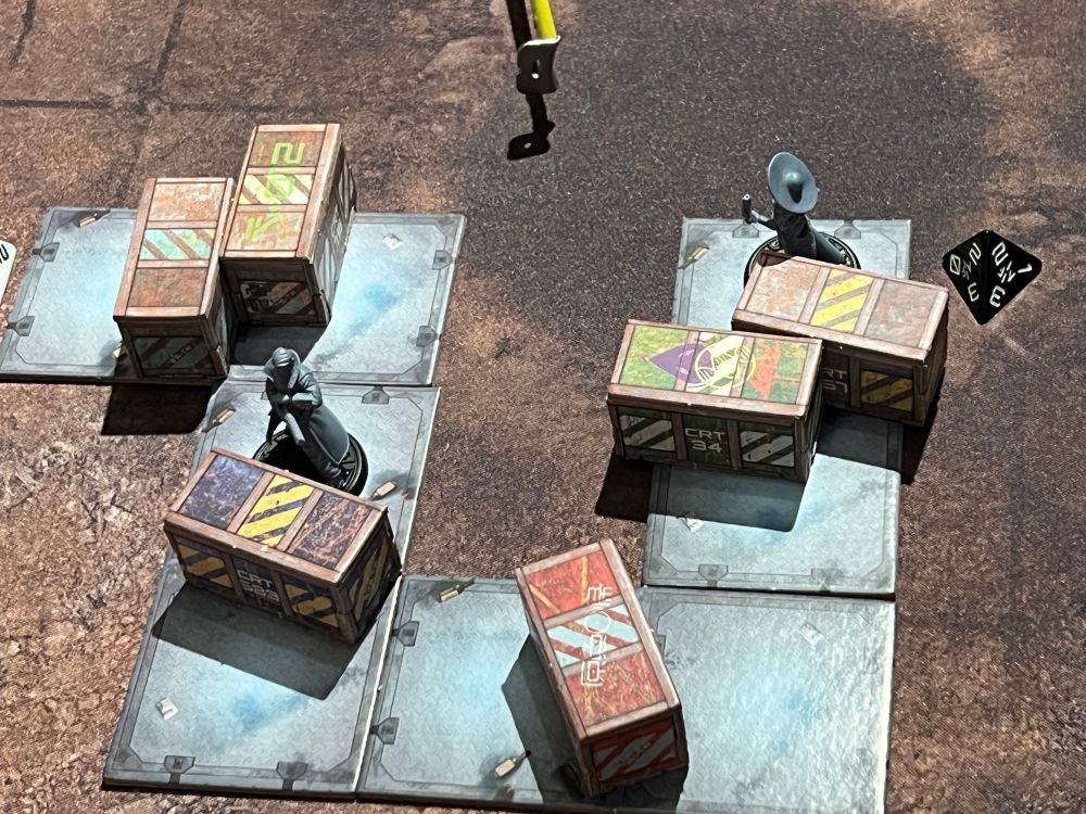 Scenario 1 „The Race“ is a simple jump and run setting. Shown characters are placed on card board tile, their way to success blocked by card board boxes.