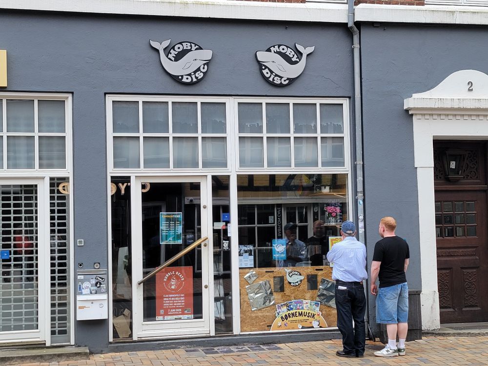 A vinyl store called Moby Disc with a whale logo. 