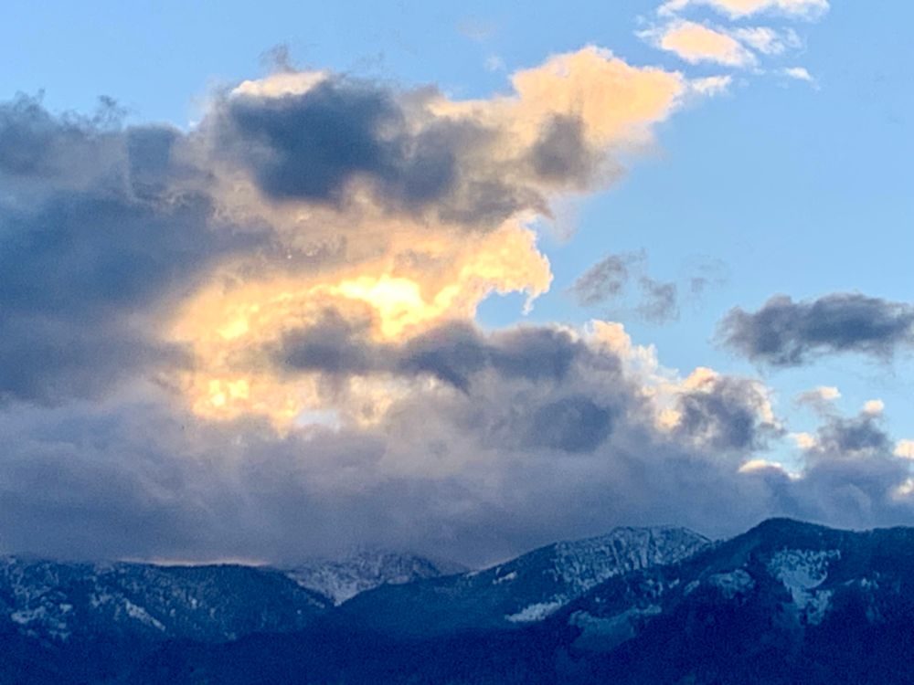 Morning sunrise over a snow topped mountain range