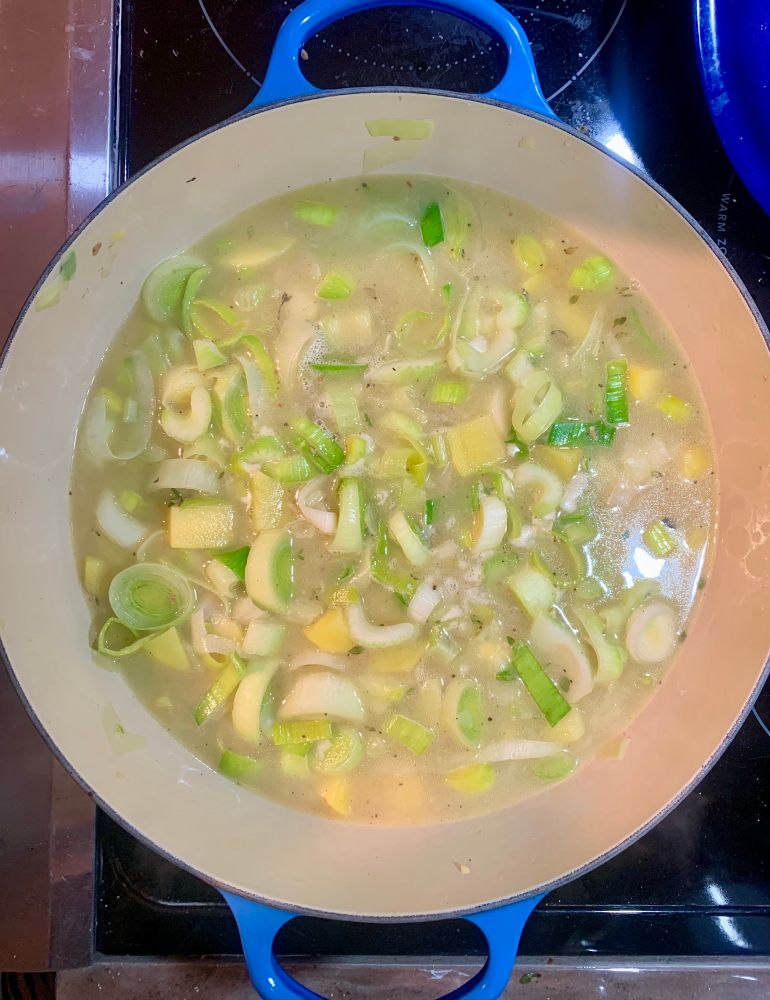 Chicken broth, fresh time, S & P get added and simmered for 15-20 minutes. 