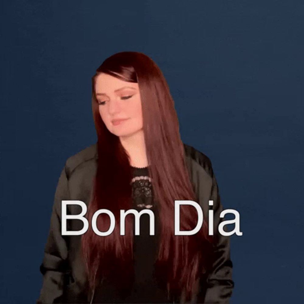 a woman wearing a black jacket says bom dia