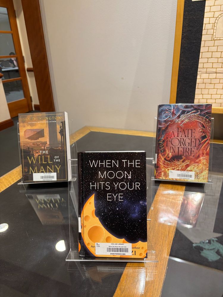 3 books. The Will of the Many by James Islington, When the Moon Hits Your Eye by John Scalzi, and A Fate Forged in Fire by Hazel McBride.