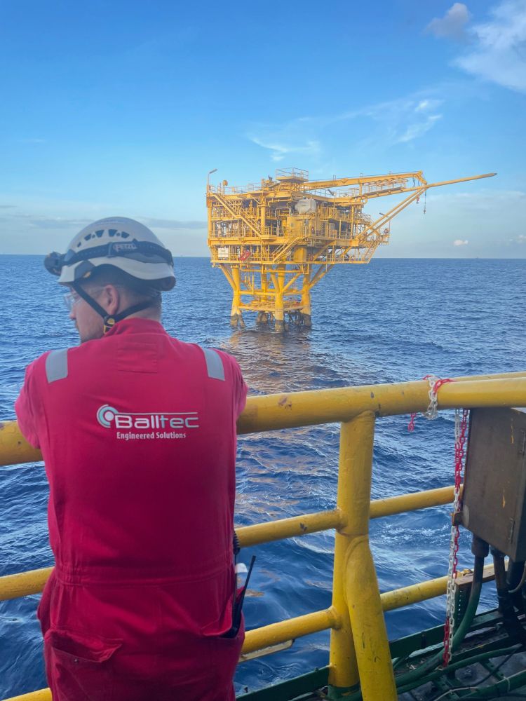 Balltec technician on an offshore sea platform overseeing a soon to be decommissioned rig.
