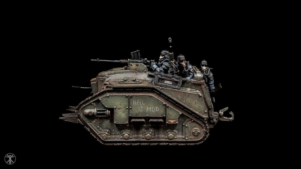 Side view of a weathered green miniature Death Korps of Krieg assault troop carrier for Warhammer 40K.