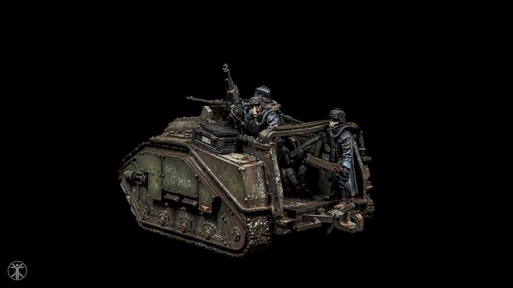 Rear view of a weathered green miniature Death Korps of Krieg assault troop carrier for Warhammer 40K.