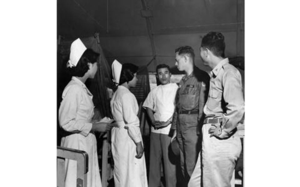 Army Hospital staff have a discussion in South Korea, 1959