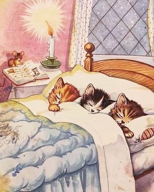 The image depicts a cozy scene with three kittens sleeping soundly in a bed, tucked under a blanket. 