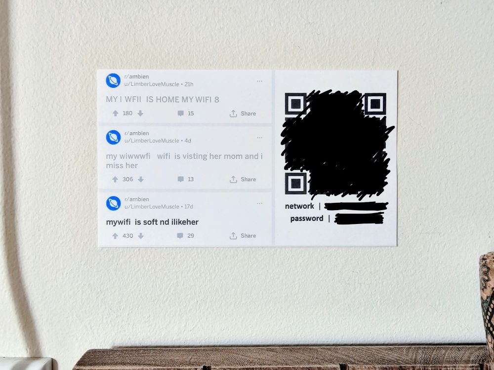 photo of a sign with a censored QR code & wifi network/password information. the sign shows the popular reddit post on r/ambien in which a user gushes about their wife, but with "wife" edited to read "wifi"