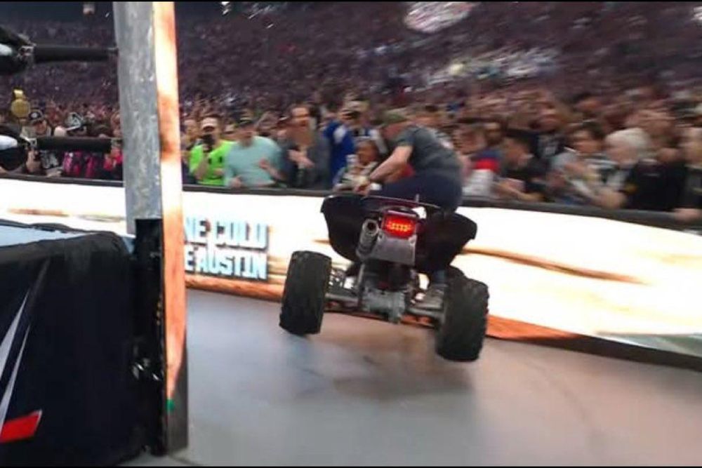 Steve Austin crashing an ATV into a crowd barrier