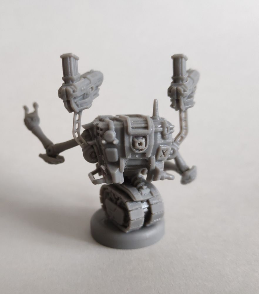 Wargames miniature - a tracked robot with four arms, rear view.