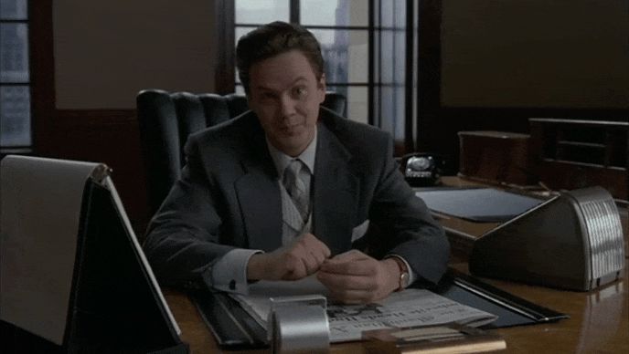 Tim Robbins in 1994’s The Hudsucker Proxy, sitting behind an executive desk in a 1950’s New York corporate office, asking “Would an imbecile come up with this?” before coyly revealing his supposedly inspired invention: a circle.