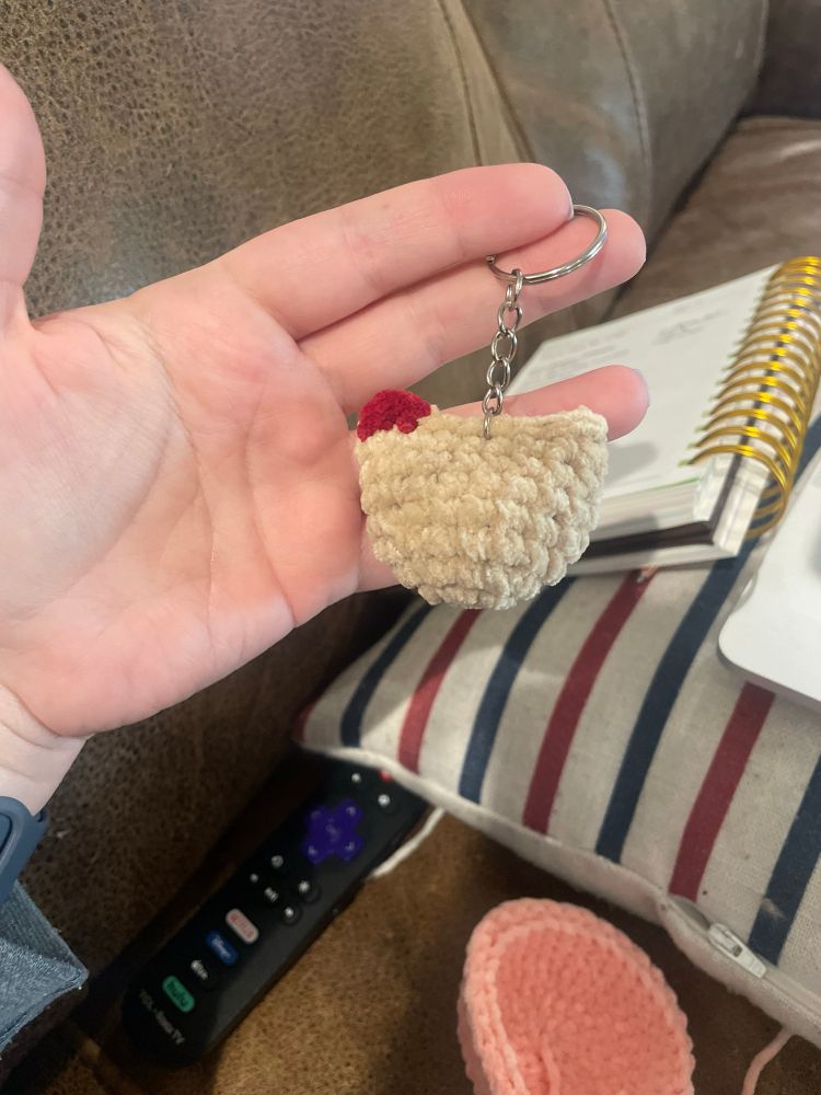 One mini crochet tan chicken on a keychain