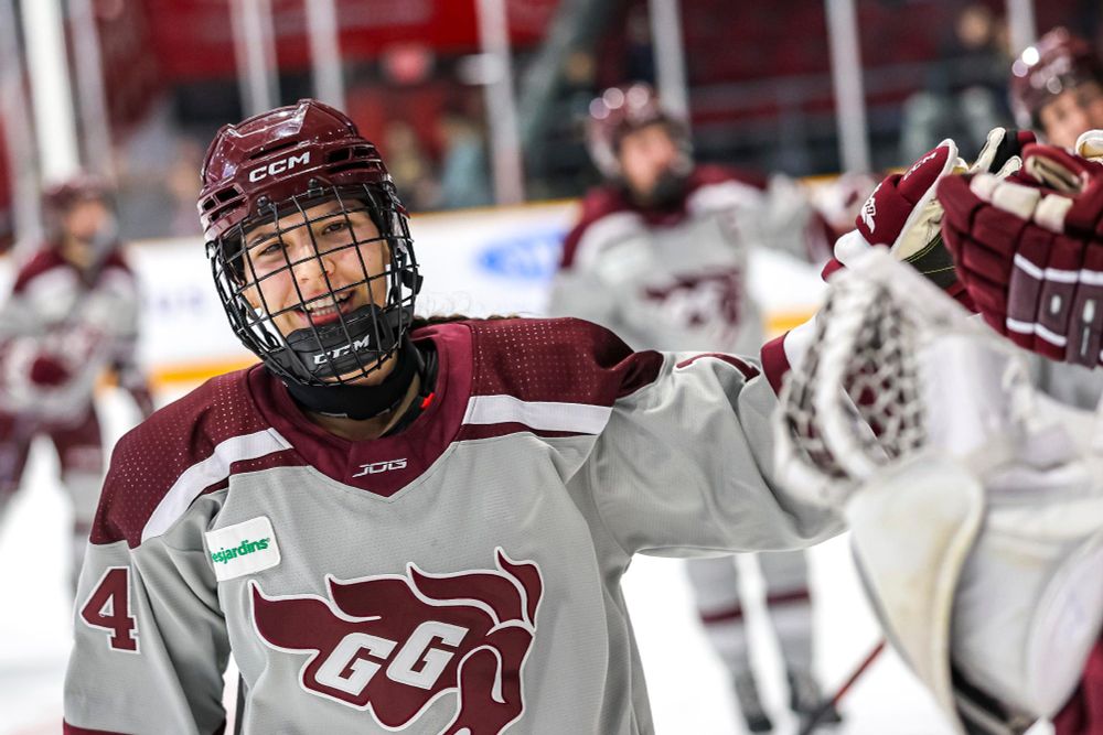 Hockey player from the University of Ottawa Gee-Gees team celebrates after a goal.