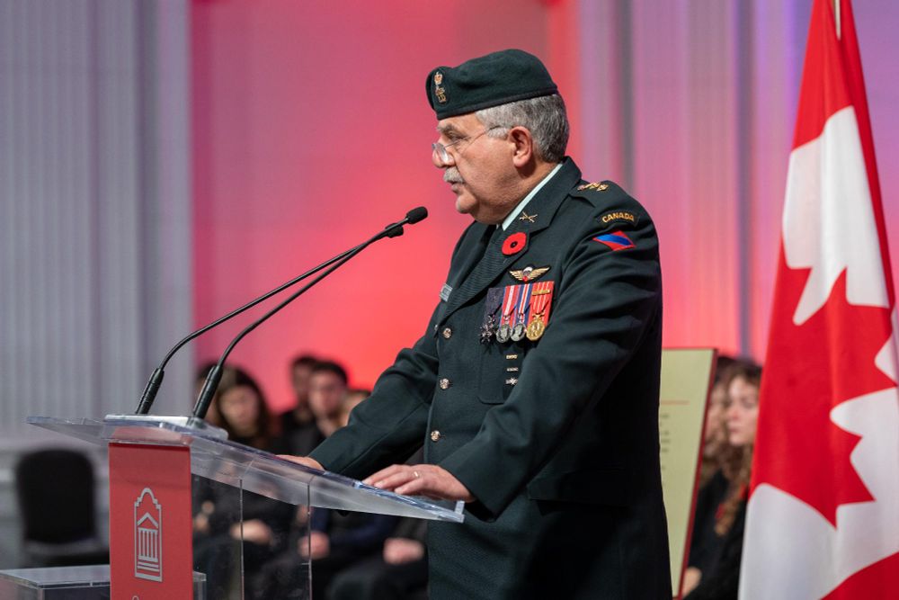 A person wearing military attire speaks during the Remembrance Day ceremony at the University of Ottawa.
