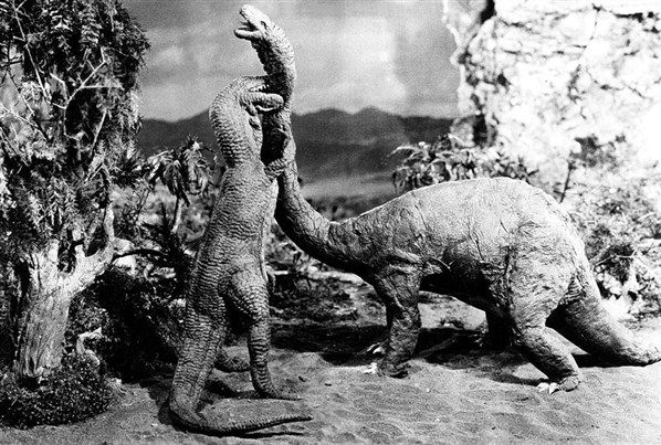 still from black and white movie of dinosaurs fighting
