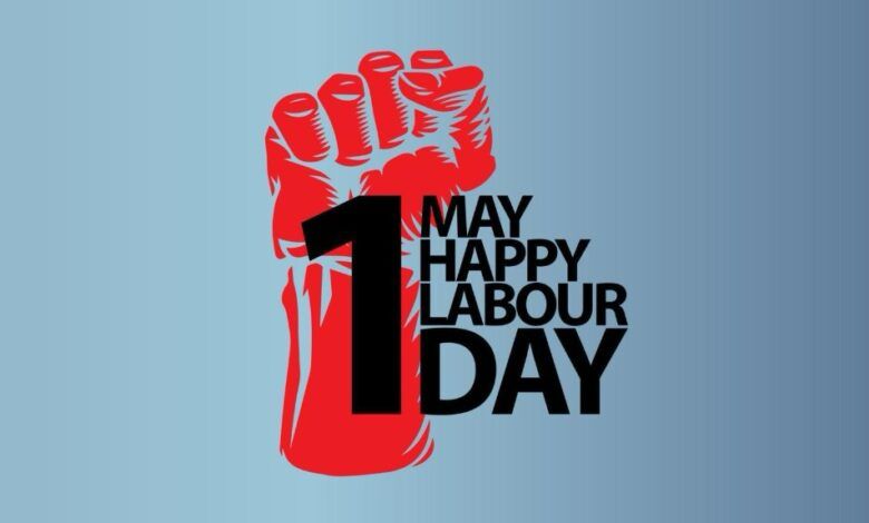 Pale grey background. A graphic of a red clenched fist. In black overlaid the text 1 May Happy Labour Day