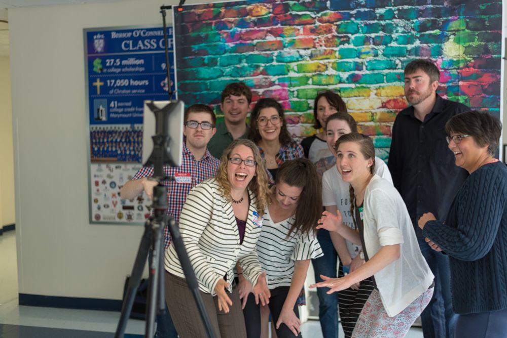 a large group posed for a photobooth