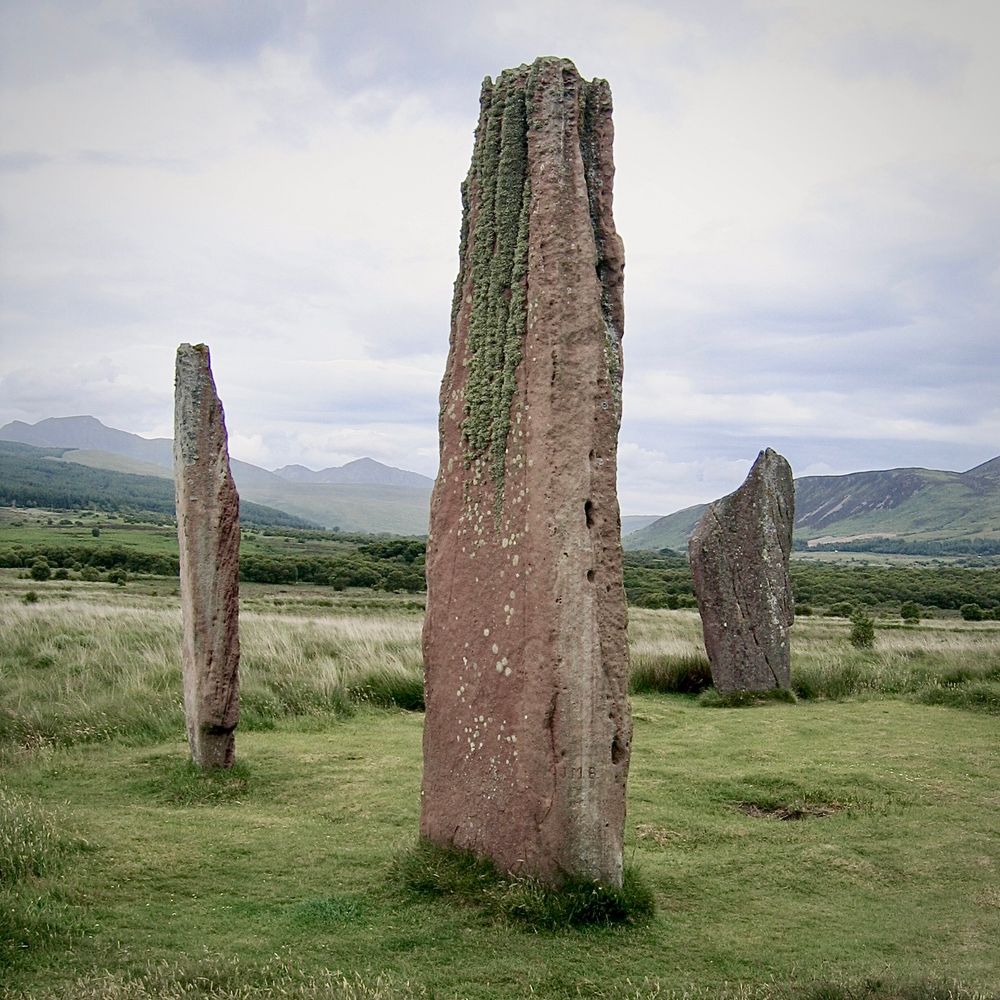 Three lichen covered standing stones at Machrie Moor, Arran. 