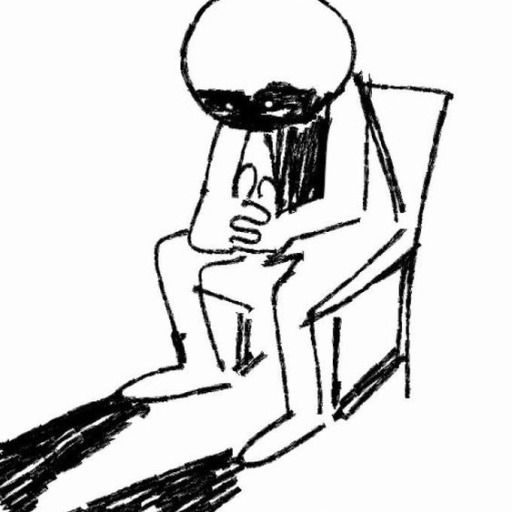 A black and white image of a person sitting in a chair. Their face and chest are shadowed and there is a shadow near their feet.