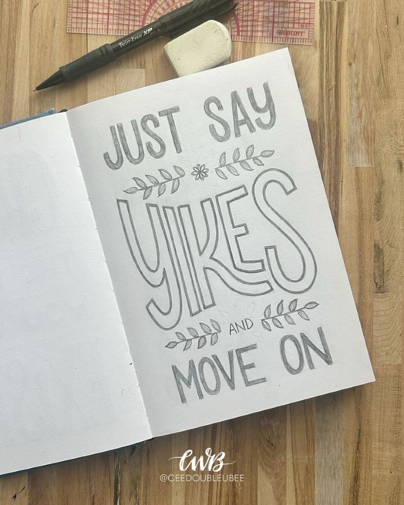 A simple sketched design that reads “Just say Yikes and move on” with two small leaf vines framing "yikes" at the top and bottom
