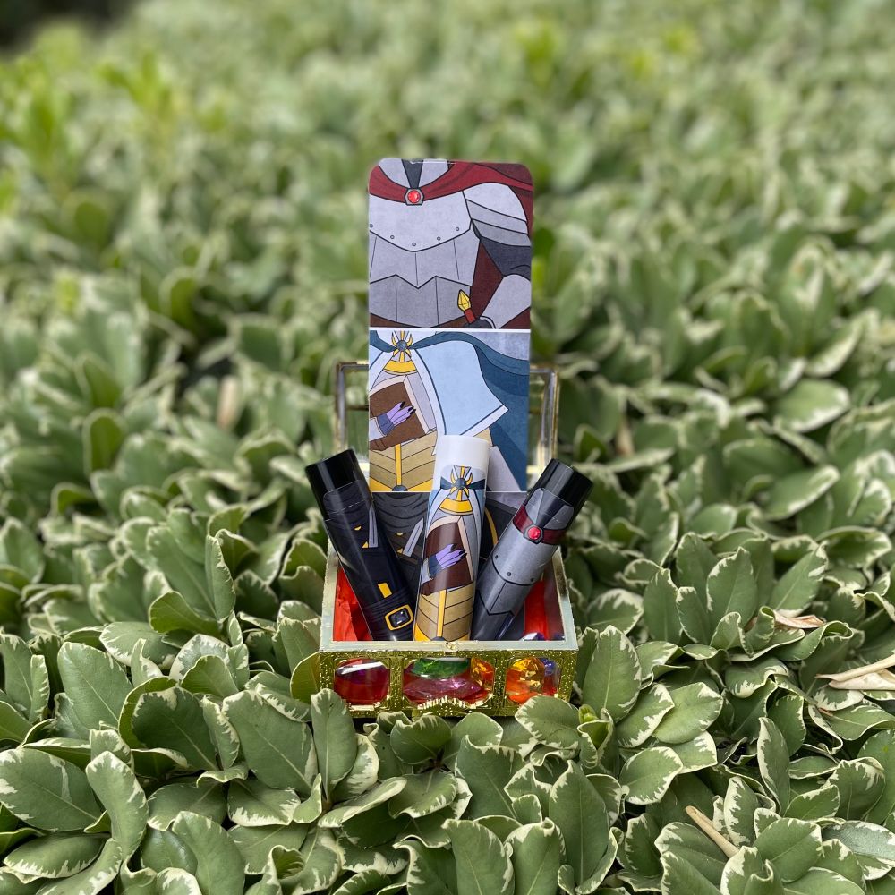 A photo of three lip balms in a little treasure chest