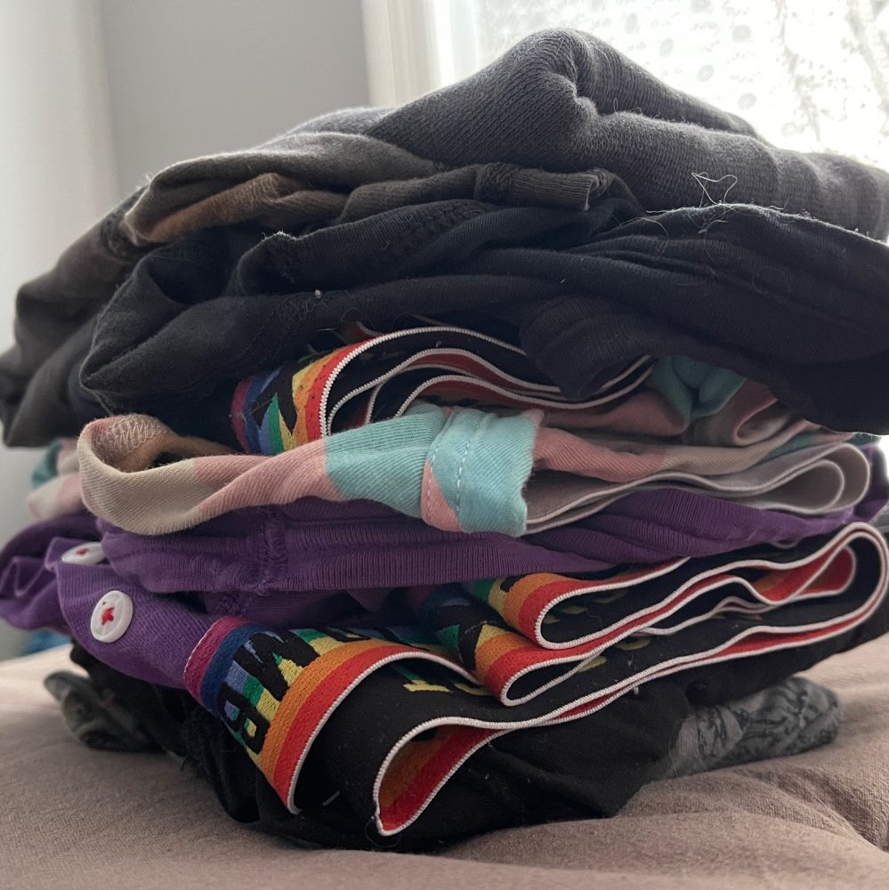 a close up picture of a stack of folded boxers, probably 5-6 pairs or so
