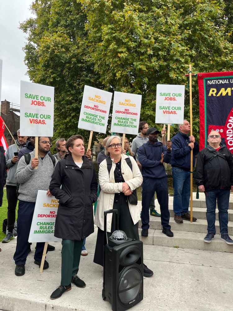 Caroline and Carla Denyer listening to speeches at RMT rally for workers affected by skilled worker visa changes. 