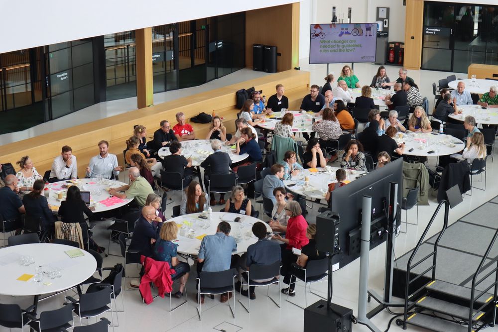 A room filled with attendees at Changing the Narrative ending the acceptance of road death in London event discussing ideas to feed into TfL’s Vision Zero Action Plan 2. 