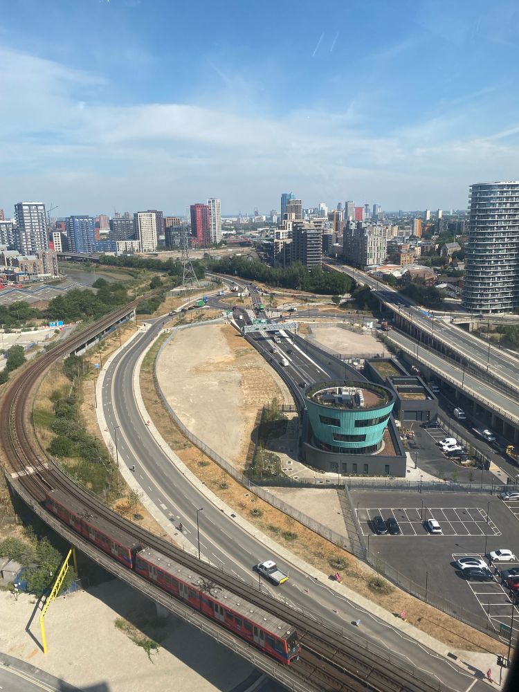 Aerial view of Silvertown Tunnel site before tunnel emerged. Circular green observation tower already built. 