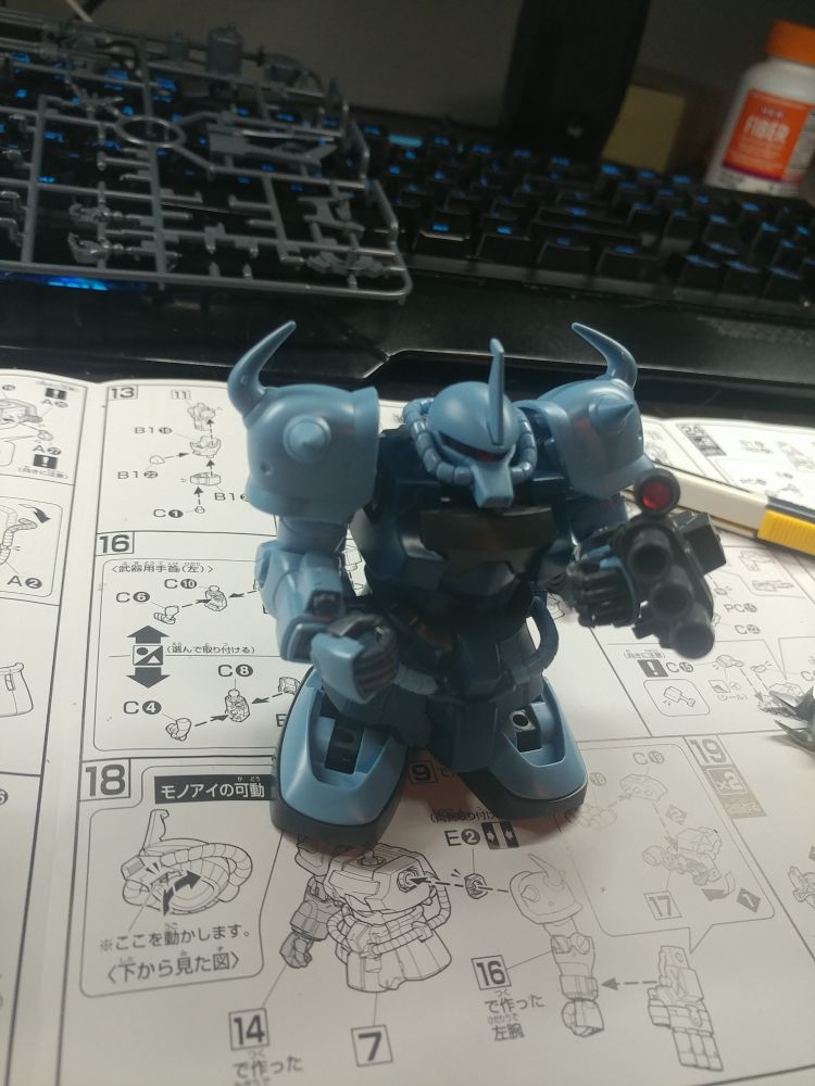 Model kit gouf in progress. The torso sitting on the feet without legs giving the gunpla a goofy proportion.