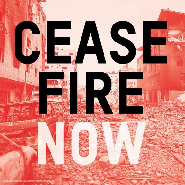 An image of destroyed buildings with the words ‘ceasefire now’ over the top.